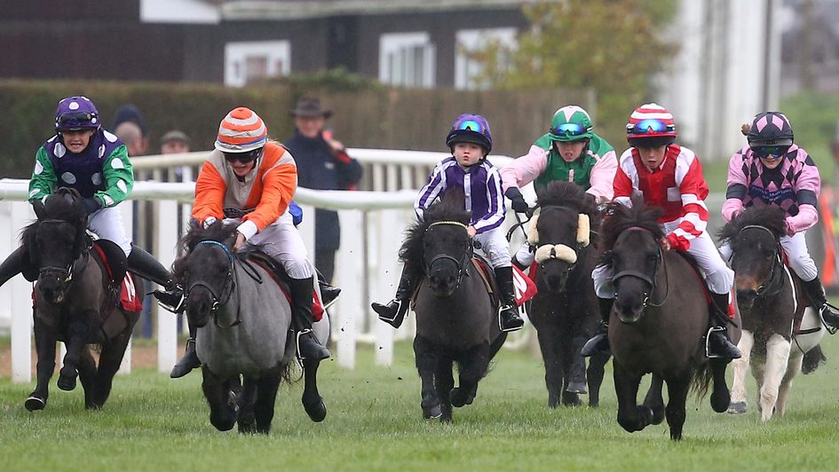 A young Toby Moore riding a Shetland Pony (centre, purple and white silks)