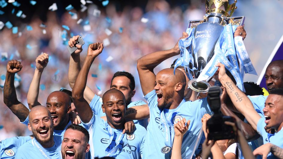 Vincent Kompany lifts the Premier League trophy