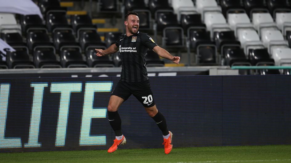 Matt Warburton celebrates his goal for Northampton against Swansea