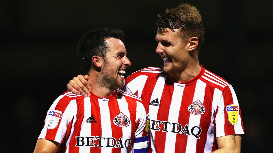 George Honeyman (left) celebrates with Max Power
