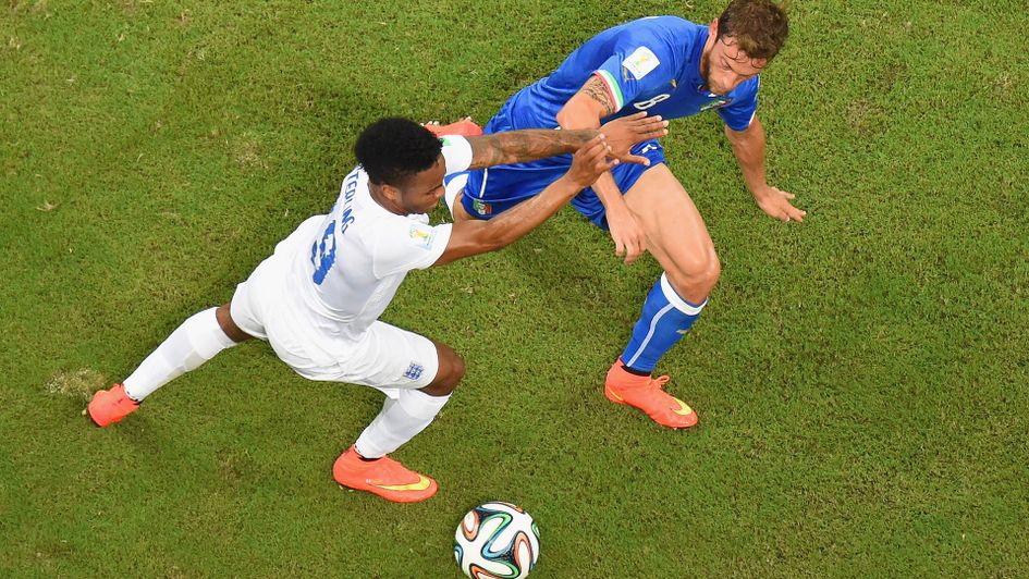 Raheem Sterling battles Claudio Marchisio at the World Cup in 2014