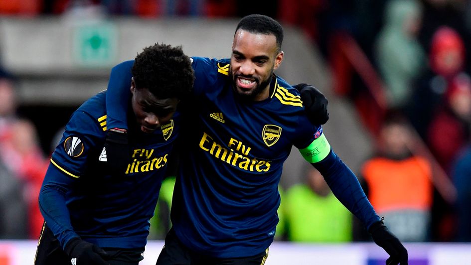 Arsenal celebrate a goal at Standard Liege