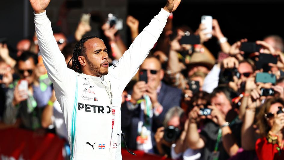 Lewis Hamilton celebrates his sixth world title