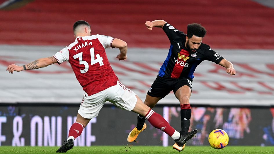 Granit Xhaka and Andros Townsend battle for the ball