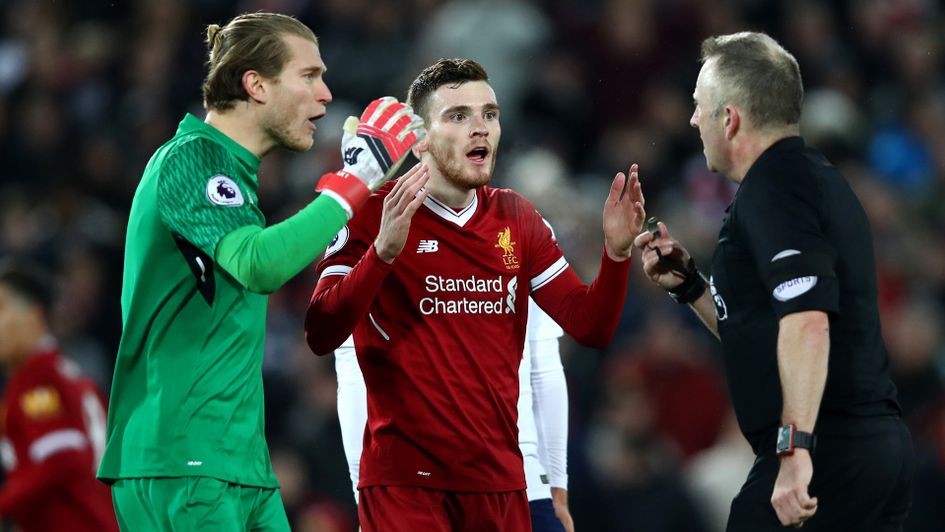 Loris Karius and Andy Robertson argue with referee Jonathan Moss