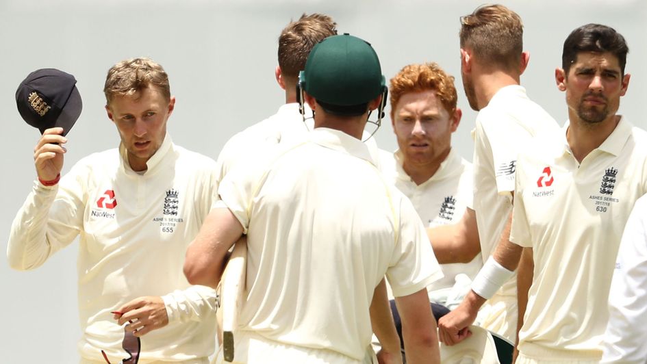 The players shake hands after Australia's win at the Gabba