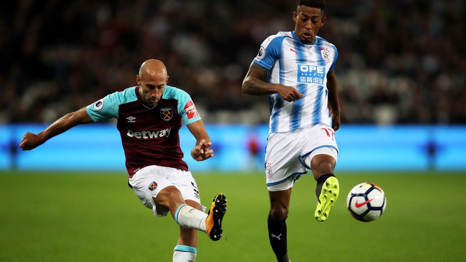 Pablo Zabaleta of West Ham beats Rajiv van La Parra of Huddersfield