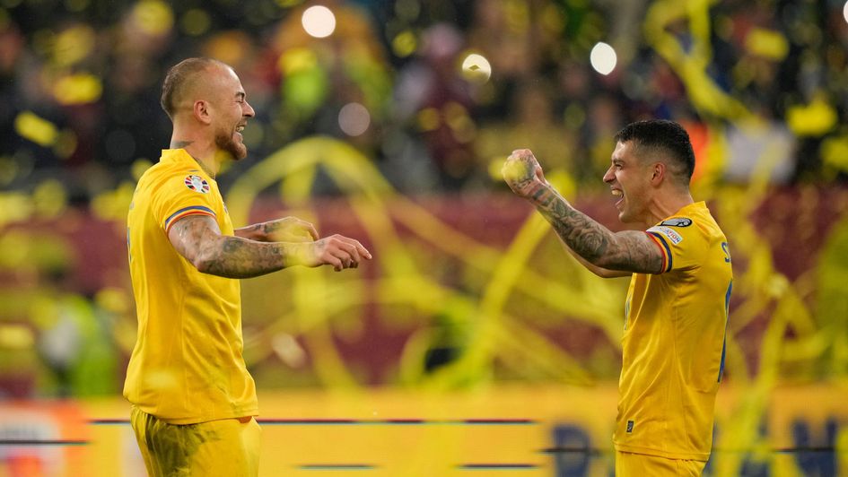 Romania's Denis Alibec and Nicolae Stanciu celebrate