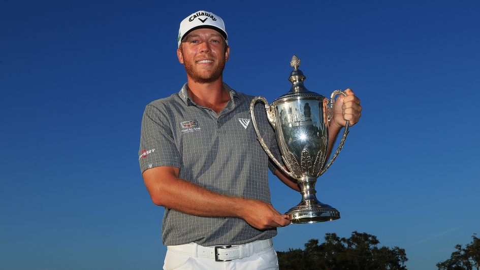 Talor Gooch celebrates with the trophy after winning the RSM Classic