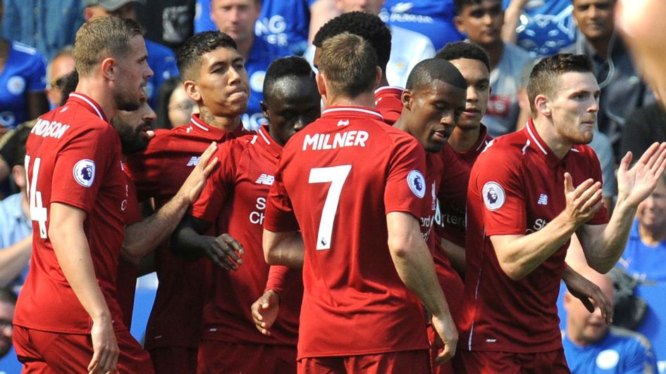 Liverpool players celebrate after scoring against Leicester