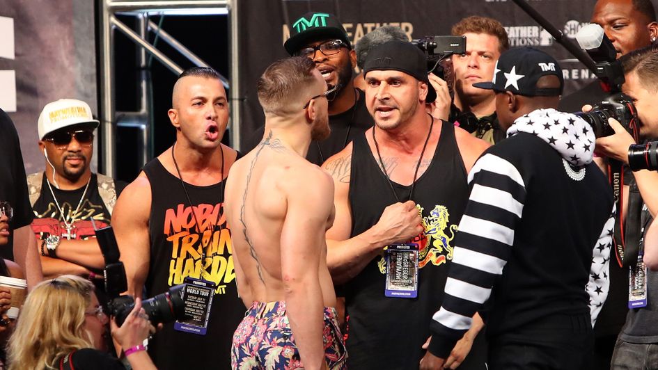 Conor McGregor chats to Floyd Mayweather team