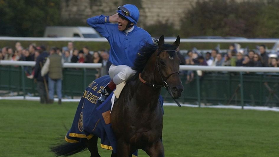 Frankie Dettori celebrates his third Arc with Marienbard in 2002