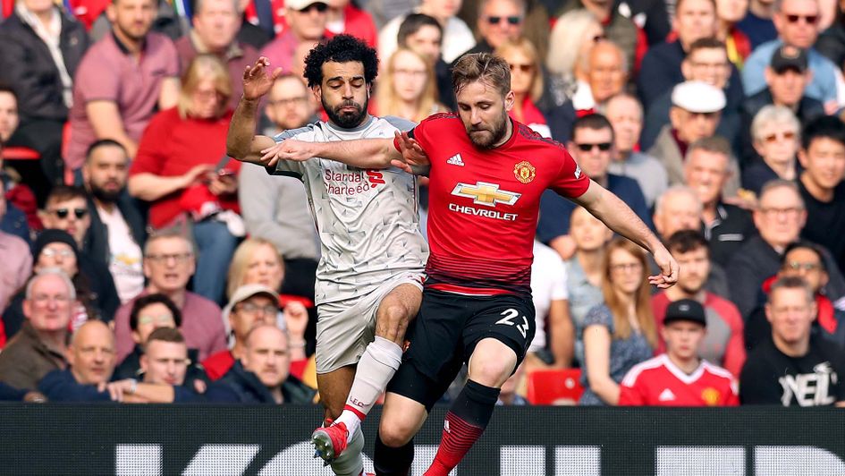 Mo Salah and Luke Shaw battle during Man Utd v Liverpool at Old Trafford