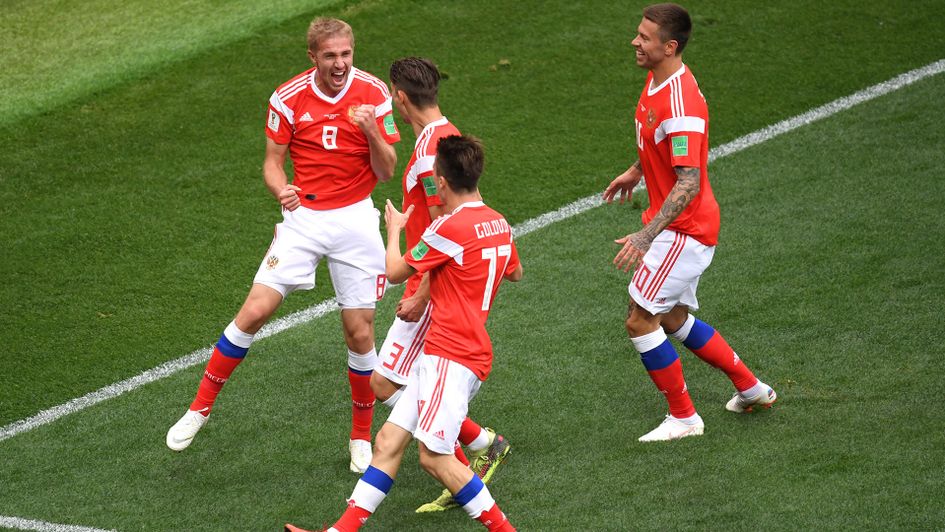 Russia's Yury Gazinsky celebrates with his team-mates after scoring the first goal of the 2018 World Cup