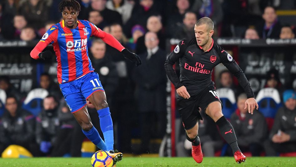 Wilfried Zaha gets away from Jack Wilshere