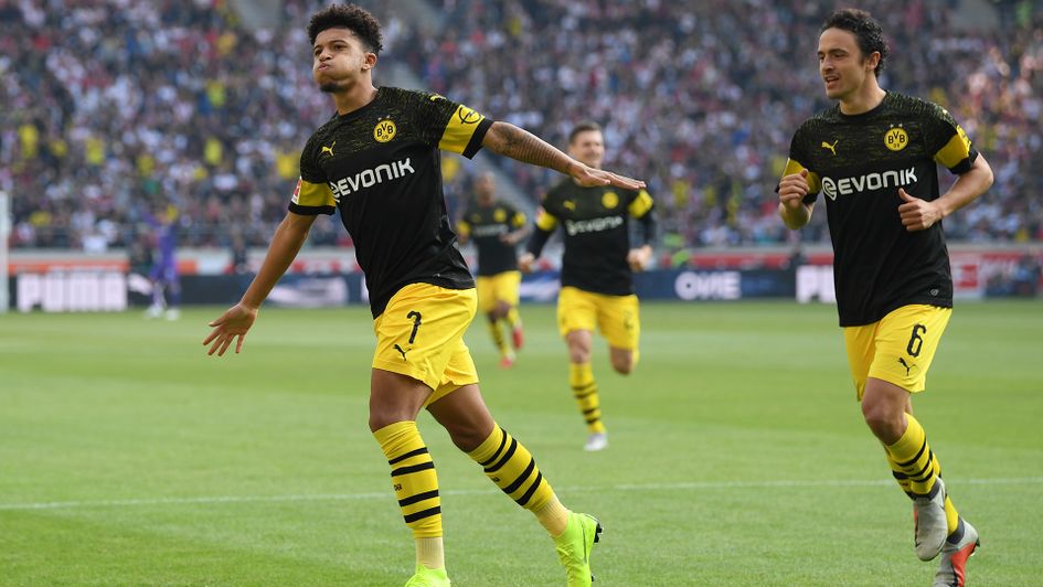 Jadon Sancho (left) celebrates after scoring against Stuttgart