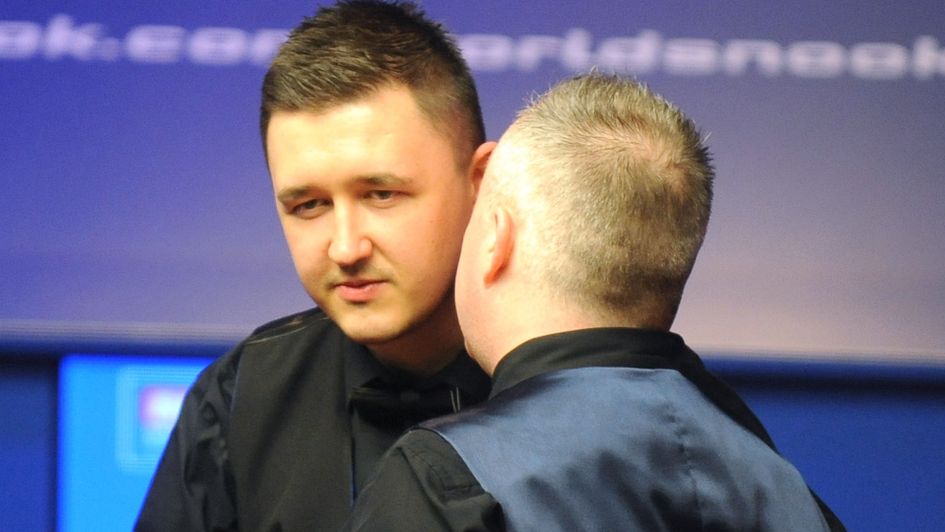 Kyren Wilson is consoled by John Higgins