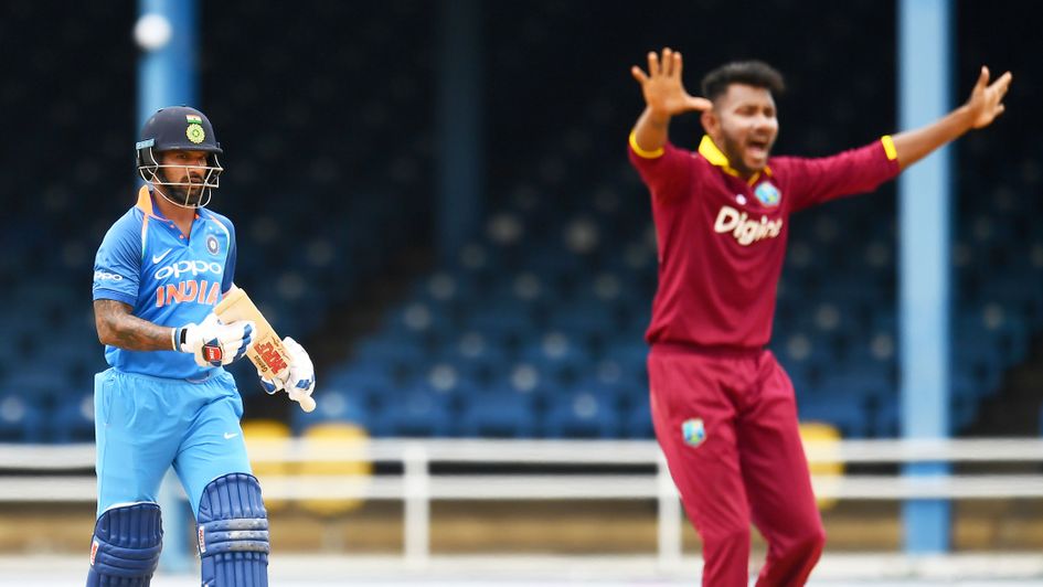 Shikhar Dhawan (left) and Devendra Bishoo