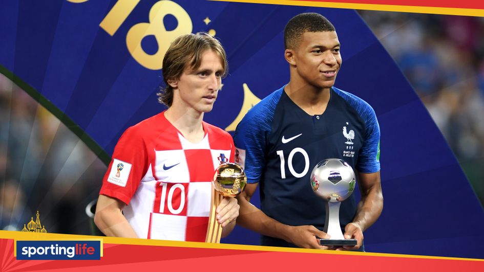 Luka Modric (left) collects his World Cup Golden Boot award, while Kylian Mbappe wins young player of the tournament