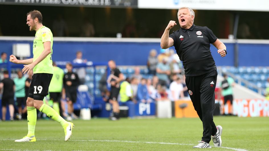 Chris Wilder celebrates after victory over QPR