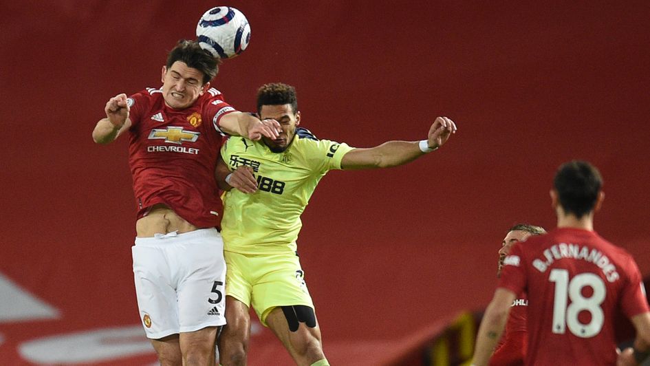 Harry Maguire wins a header against Newcastle