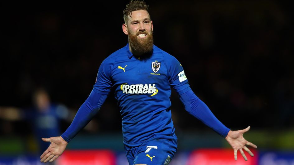Scott Wagstaff of AFC Wimbledon celebrates after scoring