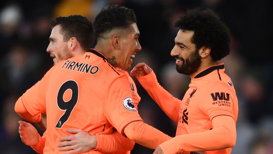 Roberto Firmino and Mohamed Salah celebrate
