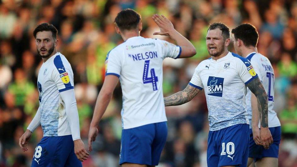 Tramere Rovers' James Norwood (right) celebrates scoring