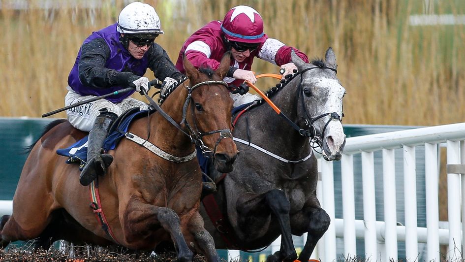 Mr Adjudicator (left) and Farclas jump the last together