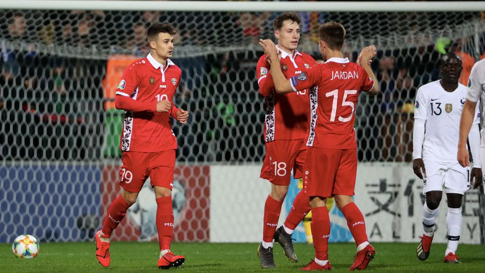 Moldova celebrate a surprise goal against France