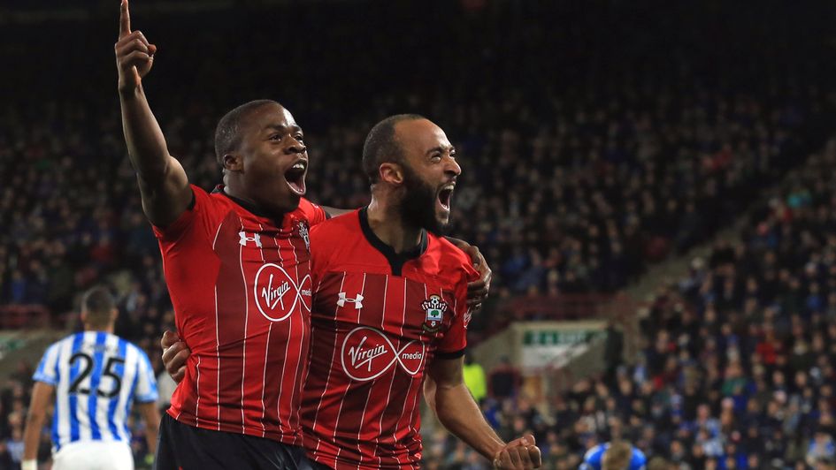 Michael Obafemi (left) celebrates with Southampton team-mate Nathan Redmond at Huddersfield
