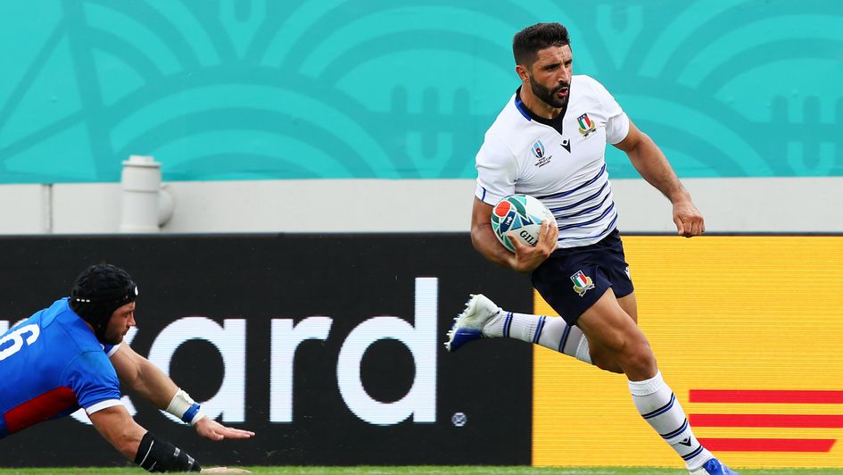 Tito Tebaldi crosses for one of Italy's seven tries against Namibia