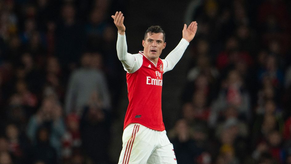 Granit Xhaka responds to the crowd reaction after he is substituted