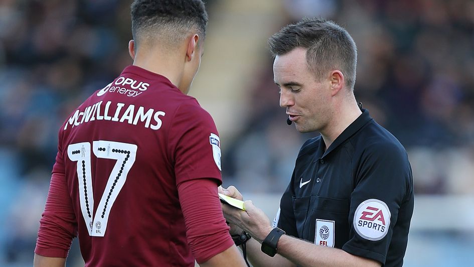 Ross Joyce issues a card to Shaun McWilliams