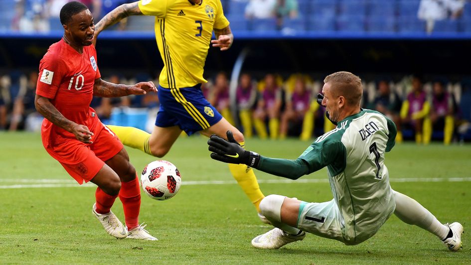 Raheem Sterling attempts to go around Robin Olsen