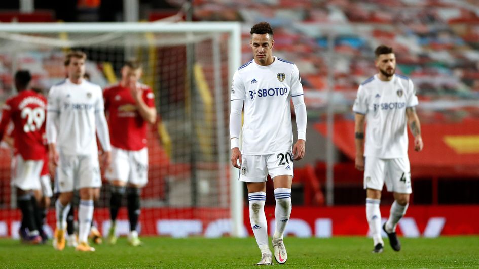 Leeds look dejected after conceding another goal at Manchester United