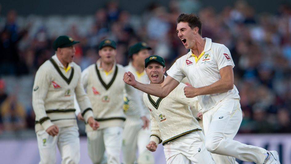 Pat Cummins celebrates after bowling Joe Root out in the fourth Ashes test between England and Australia at Old Trafford