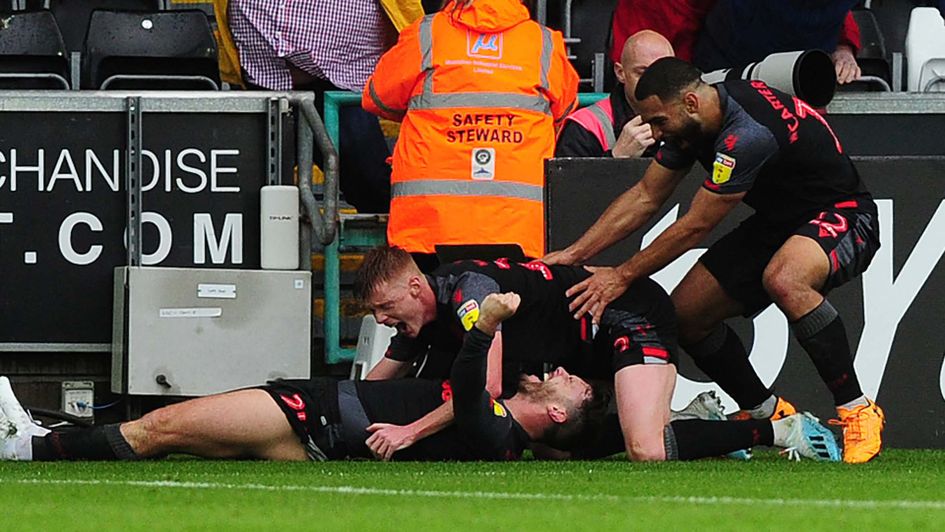 Stoke celebrate a late winner at Swansea