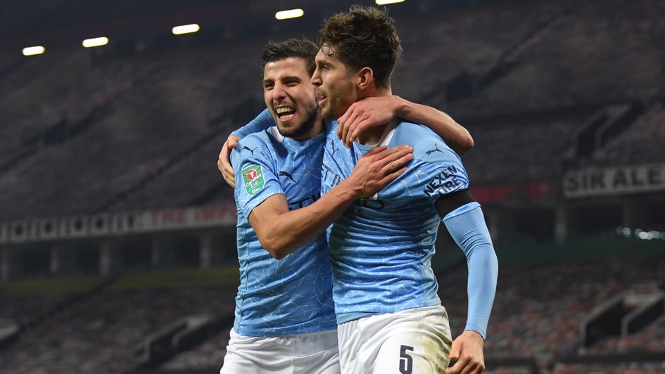Ruben Dias and John Stones celebrate