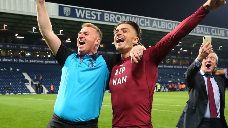 Dean Smith and Jack Grealish celebrate Villa's victory at The Hawthorns in the Championship play-off semi-finals in 2019.