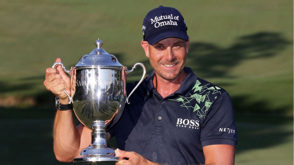 Henrik Stenson shows off the silverware