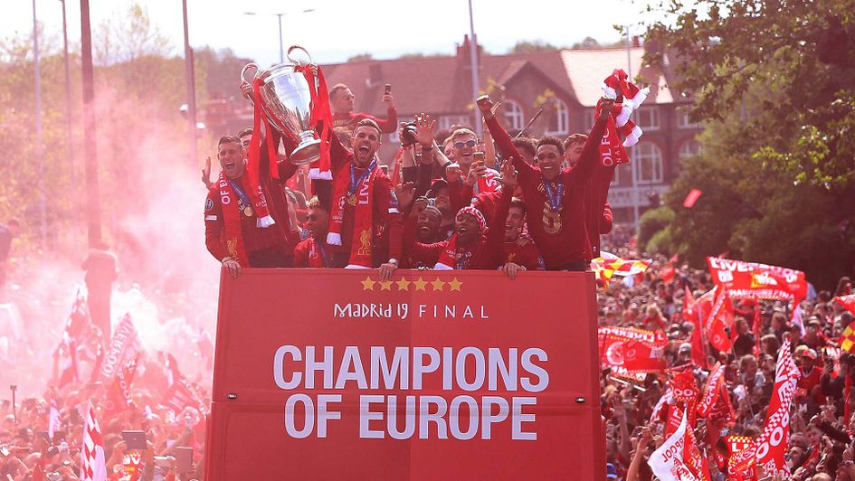 Liverpool celebrate their Champions League win with a trophy parade around the city