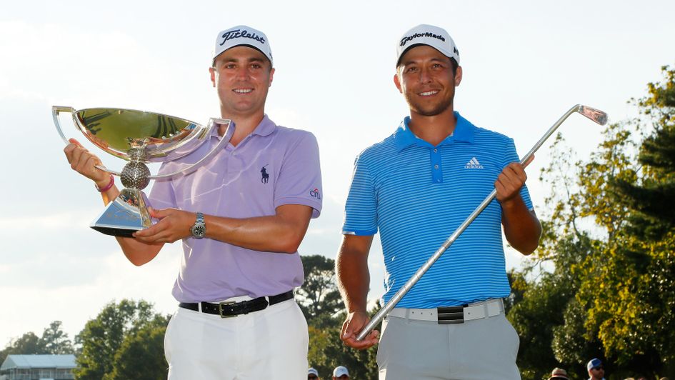 Justin Thomas celebrates with the FedEx Cup trophy alongside Xander Schauffele with the TOUR Championship trophy