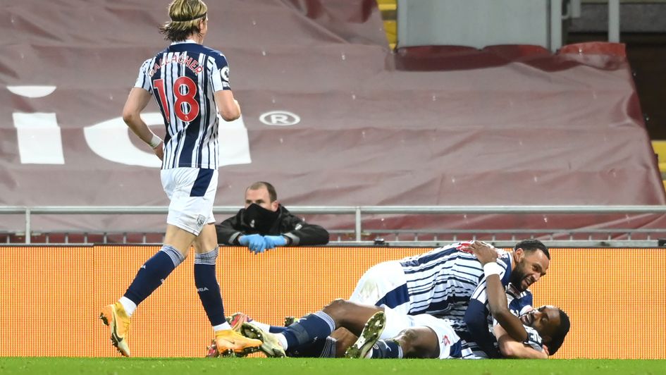 Semi Ajayi is mobbed after scoring West Brom's equaliser at Liverpool