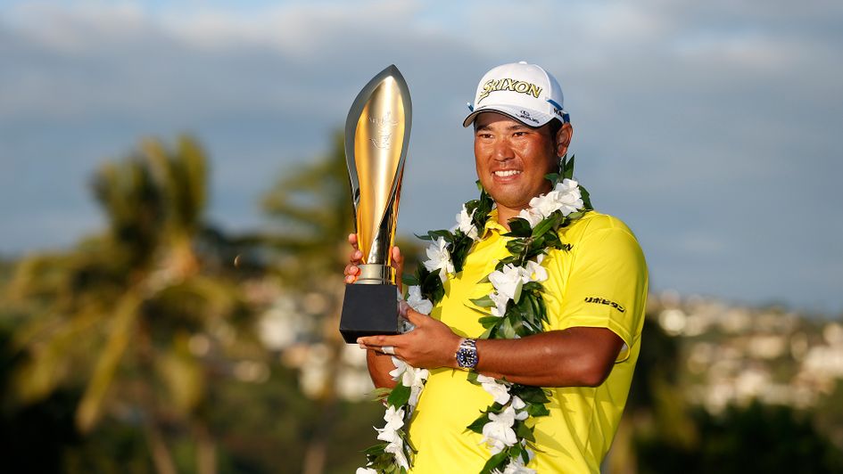 Hideki Matsuyama celebrates with the trophy after winning the Sony Open in Hawaii