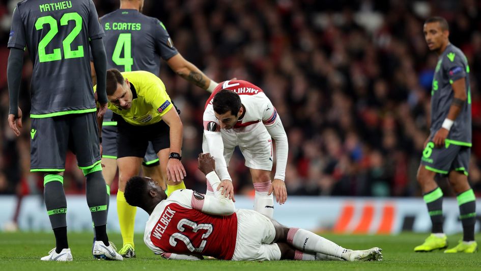 Danny Welbeck is injured in Arsenal's draw with Sporting Lisbon