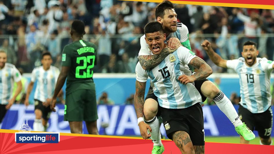 Marcos Rojo celebrates his winning goal for Argentina with Lionel Messi