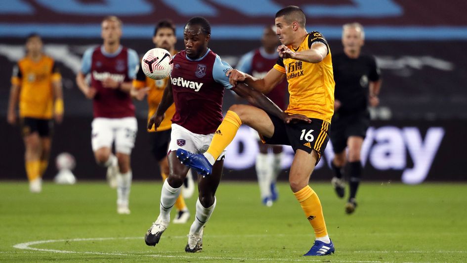West Ham's Michail Antonio and Wolves' Conor Coady battle for the ball