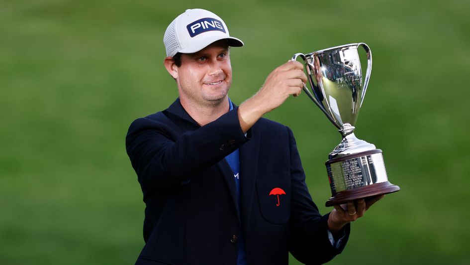 Harris English poses with the trophy after winning the Travelers Championship