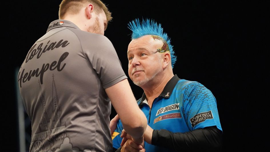 Florian Hempel defeats Peter Wright (Picture: Vincent Amman/DAZN)